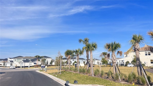 view of road with curbs and a residential view