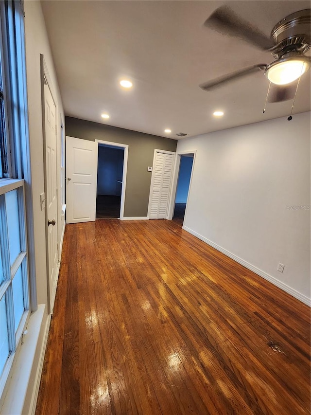 unfurnished bedroom with hardwood / wood-style flooring and ceiling fan