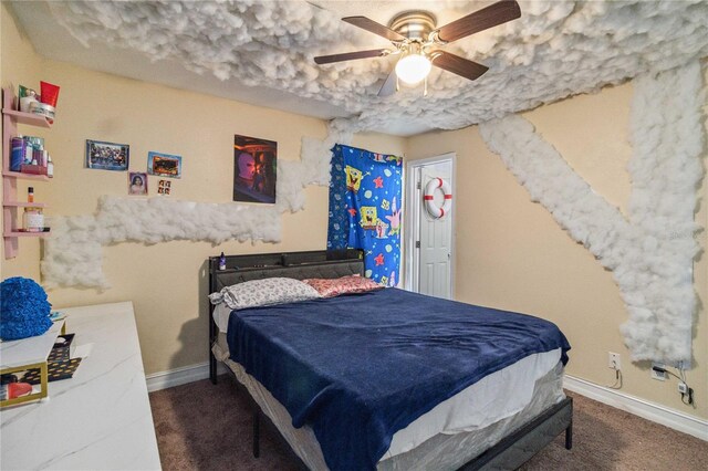 bedroom featuring dark colored carpet and ceiling fan