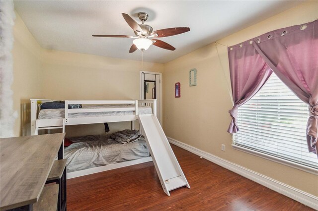 bedroom with ceiling fan and hardwood / wood-style floors