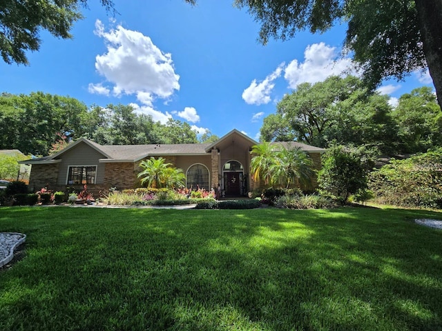 ranch-style house featuring a front yard