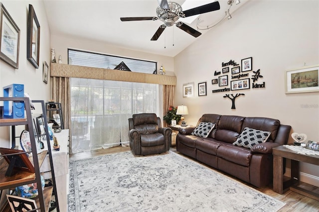 living room featuring hardwood / wood-style flooring and ceiling fan