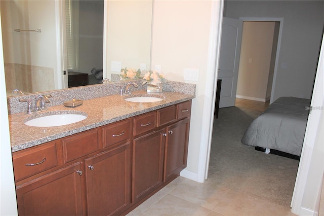 bathroom featuring tile patterned floors and dual bowl vanity