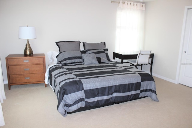 bedroom featuring light colored carpet