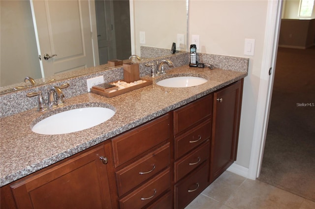 bathroom with tile patterned floors and double sink vanity