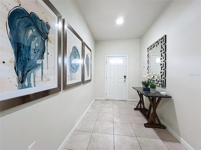 doorway featuring light tile patterned flooring