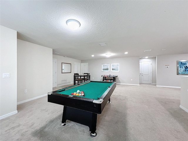 game room with pool table, carpet, and a textured ceiling