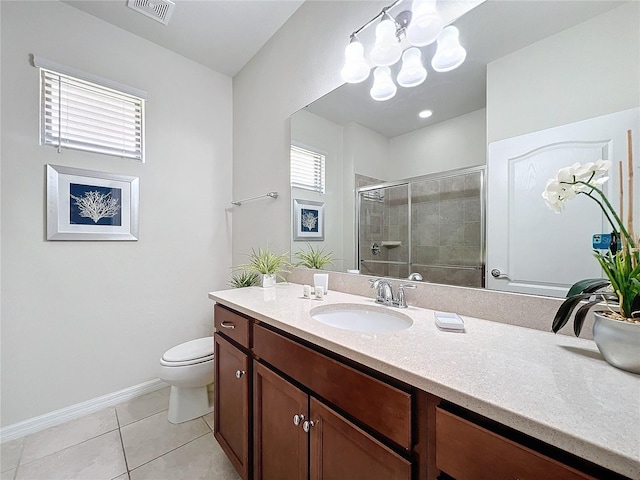 bathroom with tile patterned flooring, vanity, a wealth of natural light, and an enclosed shower