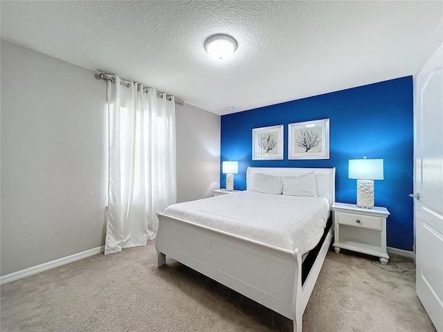 carpeted bedroom with a textured ceiling