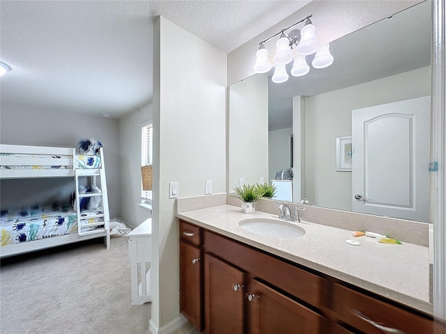 bathroom featuring vanity and a textured ceiling