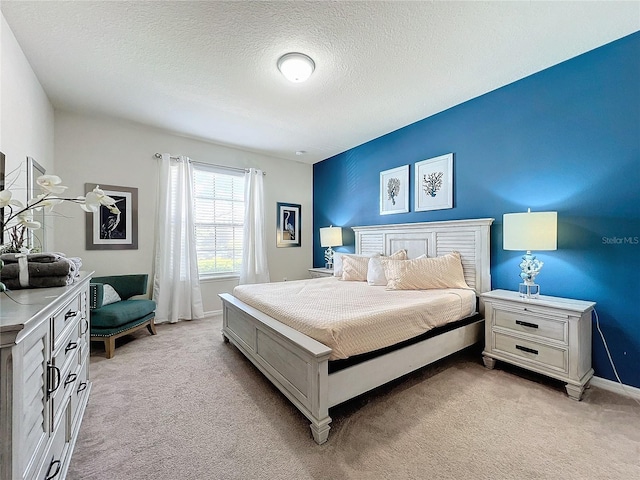 carpeted bedroom with a textured ceiling