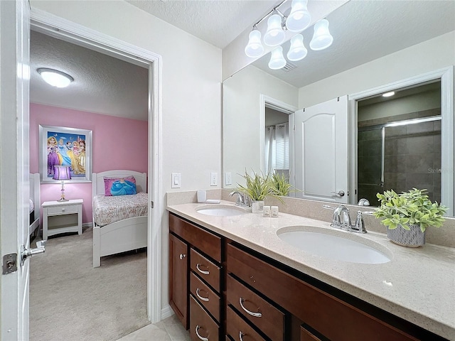 bathroom with vanity and a textured ceiling