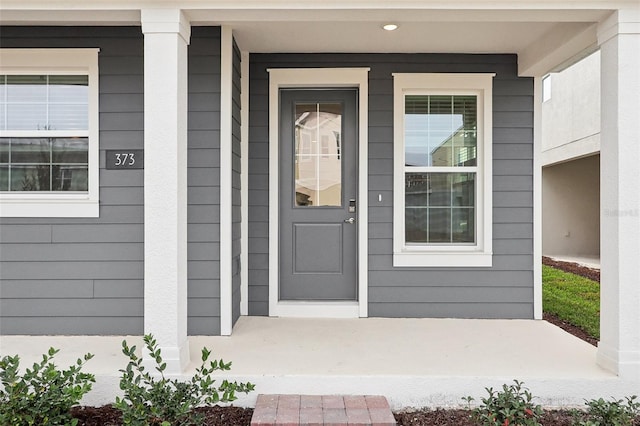 property entrance featuring covered porch