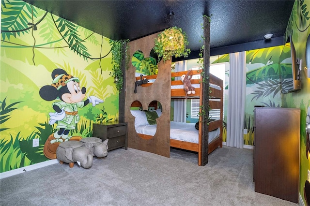 bedroom featuring carpet and a textured ceiling