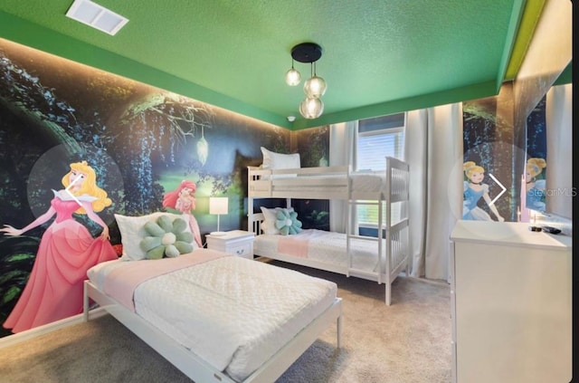 carpeted bedroom featuring a textured ceiling