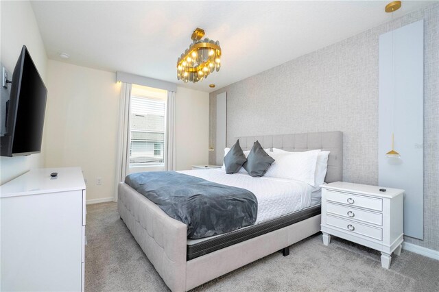 bedroom with light carpet and a notable chandelier