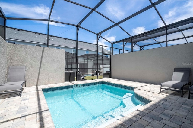 view of pool featuring a patio area, a lanai, and cooling unit