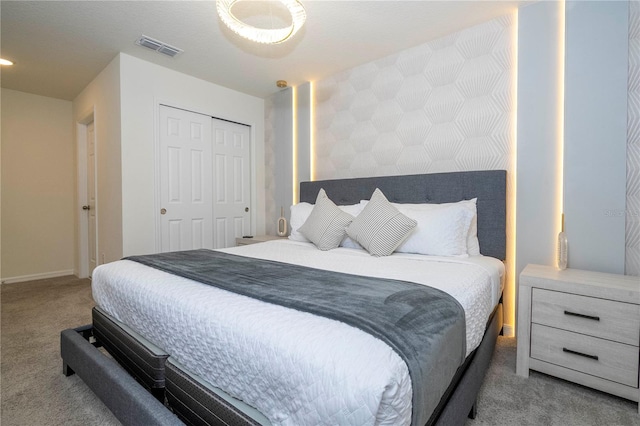 bedroom featuring a closet and carpet flooring