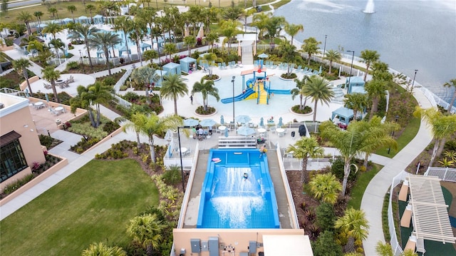 view of pool featuring a lawn