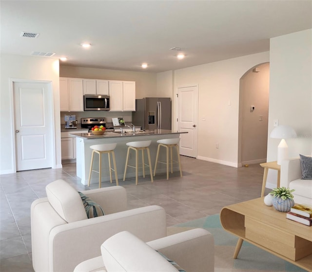 tiled living room with sink