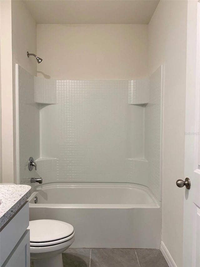 full bathroom with bathing tub / shower combination, toilet, vanity, and tile patterned flooring