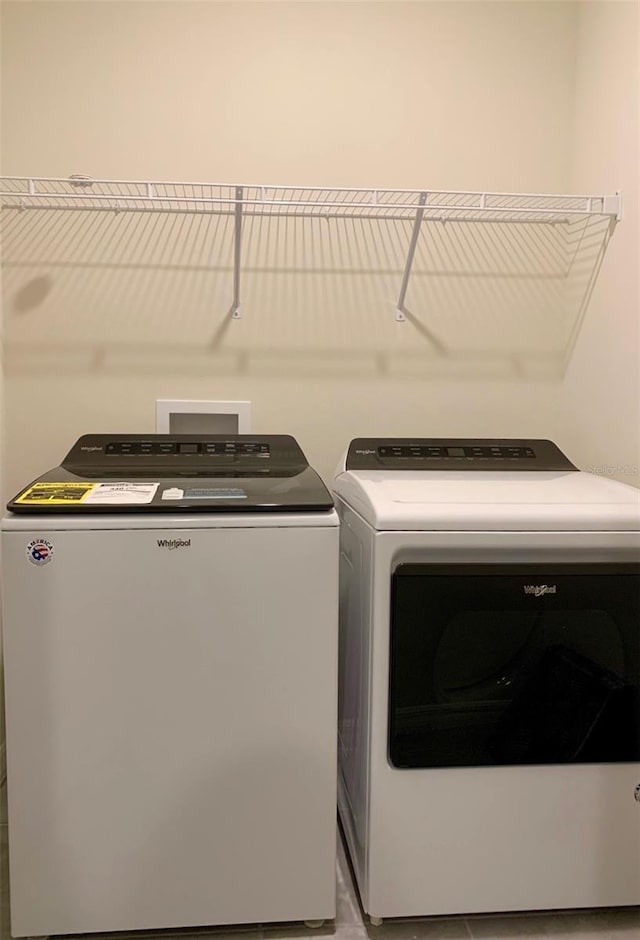 washroom featuring washing machine and dryer