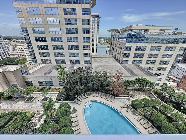 view of swimming pool with a water view