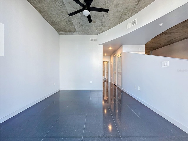 spare room featuring ceiling fan