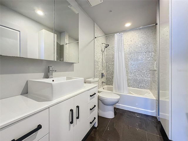 full bathroom featuring toilet, vanity, and shower / bath combo with shower curtain