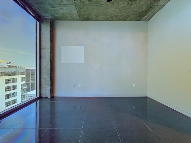 155 S Court Ave Unit 1610, Orlando, FL 32801 - spare room featuring baseboards