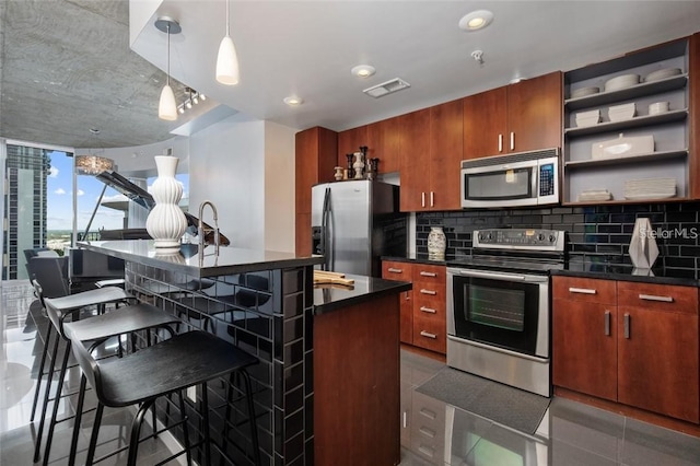 155 S Court Ave Unit 1610, Orlando, FL 32801 - kitchen with stainless steel appliances, dark countertops, open shelves, backsplash, and a kitchen breakfast bar