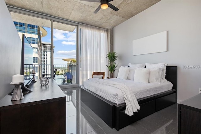 155 S Court Ave Unit 1610, Orlando, FL 32801 - tiled bedroom featuring access to outside and ceiling fan