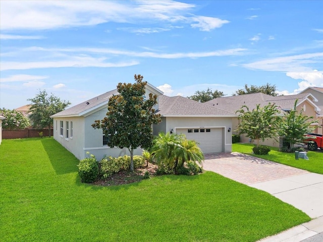 ranch-style house with a garage and a front yard