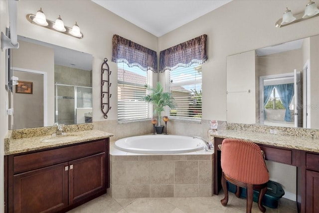 bathroom with independent shower and bath, vanity, and tile patterned flooring