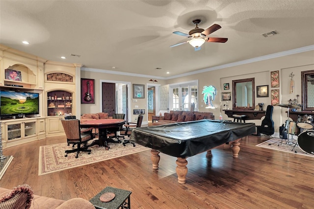 rec room featuring ceiling fan, billiards, crown molding, and hardwood / wood-style floors