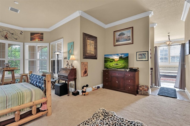 bedroom with visible vents, baseboards, carpet flooring, and crown molding