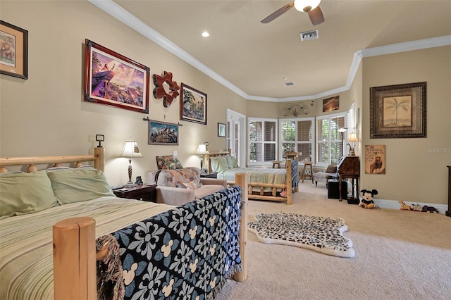 bedroom with ceiling fan, carpet, and crown molding