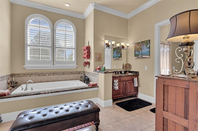 bathroom featuring tile patterned floors, vanity, crown molding, and a garden tub