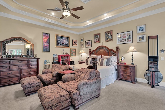 bedroom featuring a raised ceiling, light colored carpet, ceiling fan, and ornamental molding