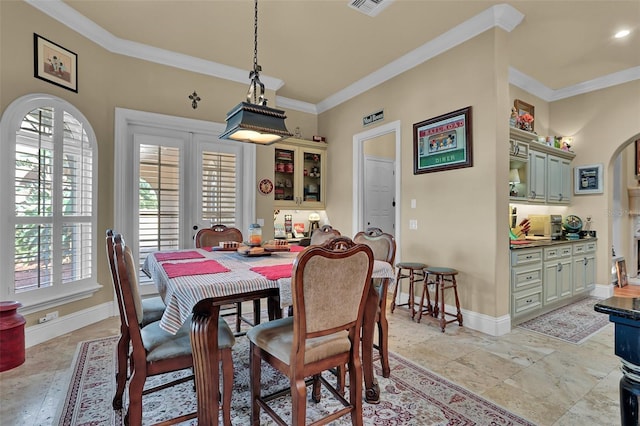 dining area featuring crown molding