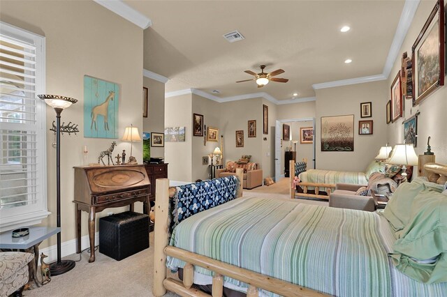 bedroom with ceiling fan, crown molding, and light colored carpet