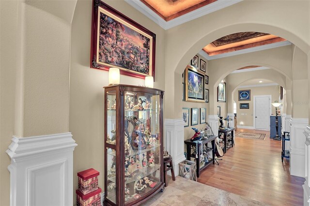 hallway featuring ornamental molding