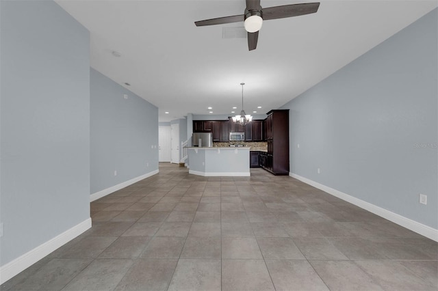 unfurnished living room featuring ceiling fan with notable chandelier and light tile patterned floors