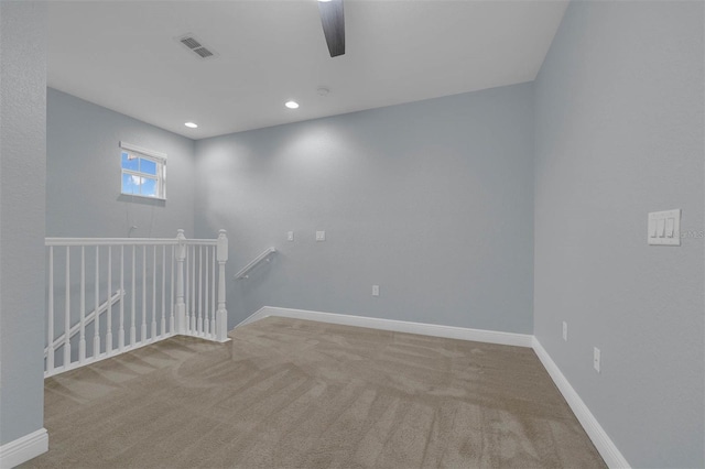 unfurnished room featuring carpet floors and ceiling fan