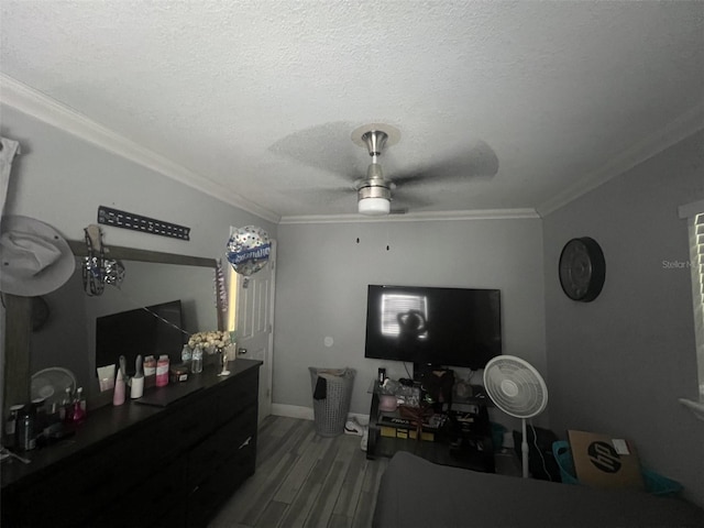 interior space featuring ornamental molding, a textured ceiling, and ceiling fan