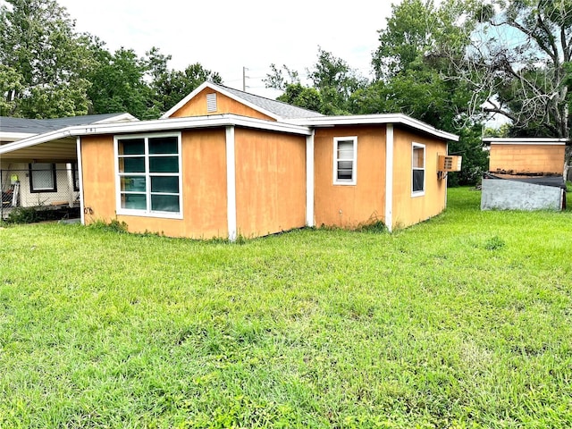 view of side of property with a yard