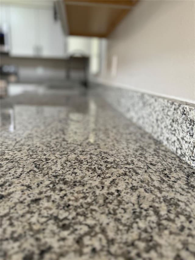 room details with light stone counters and white cabinets