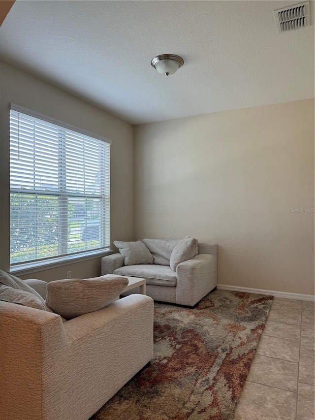 living room featuring light tile patterned floors