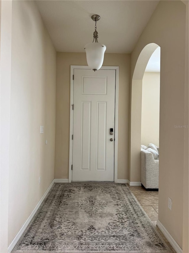 hall with light tile patterned flooring