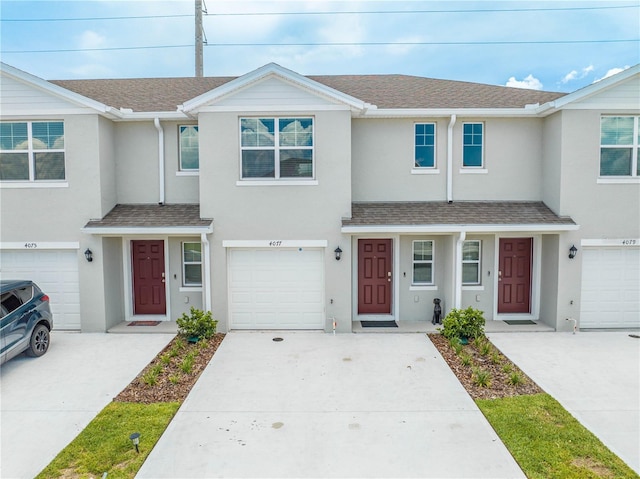 townhome / multi-family property featuring a garage